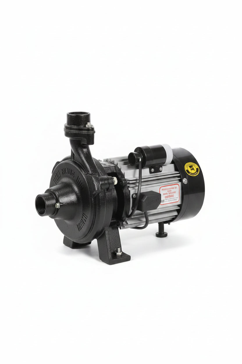 A black and silver KSP pump mounted on a wooden board, with its yellow branded retail box visible in the background on a workshop table.